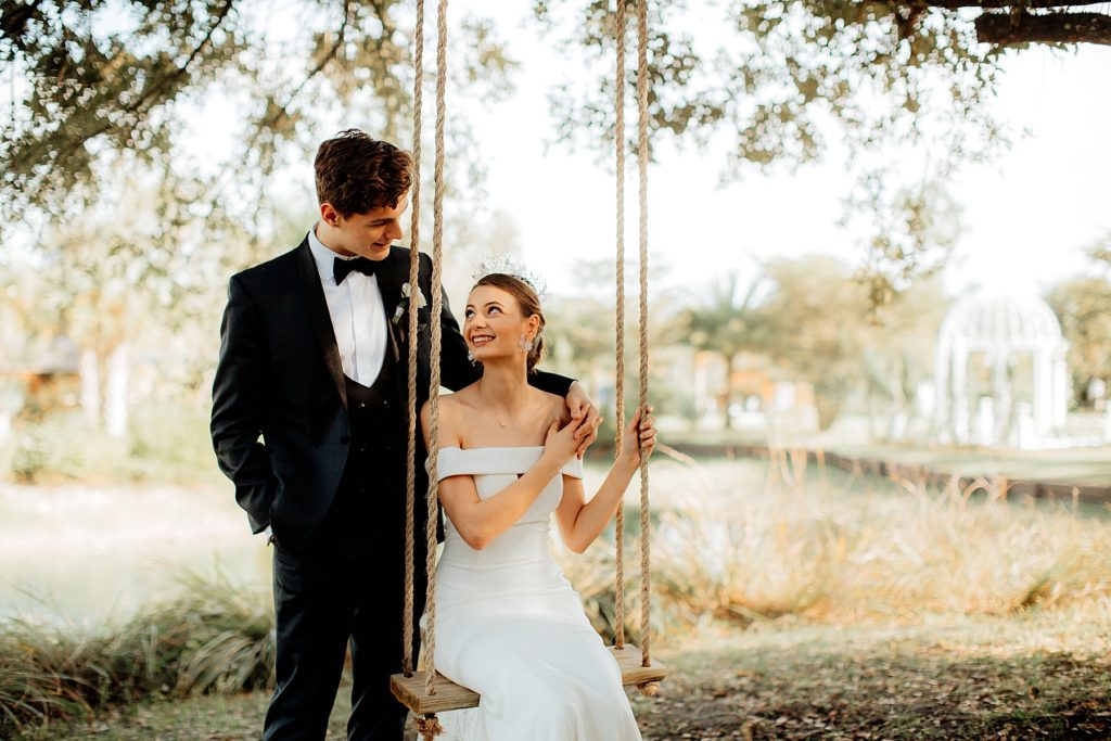 Bride and Groom on Swing at Tuscan Inspired La Casa Toscana, Fort Meyers Florida Wedding Venue