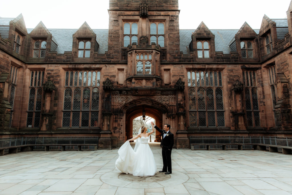 classy castle wedding couple twirling at Princeton New Jersey 